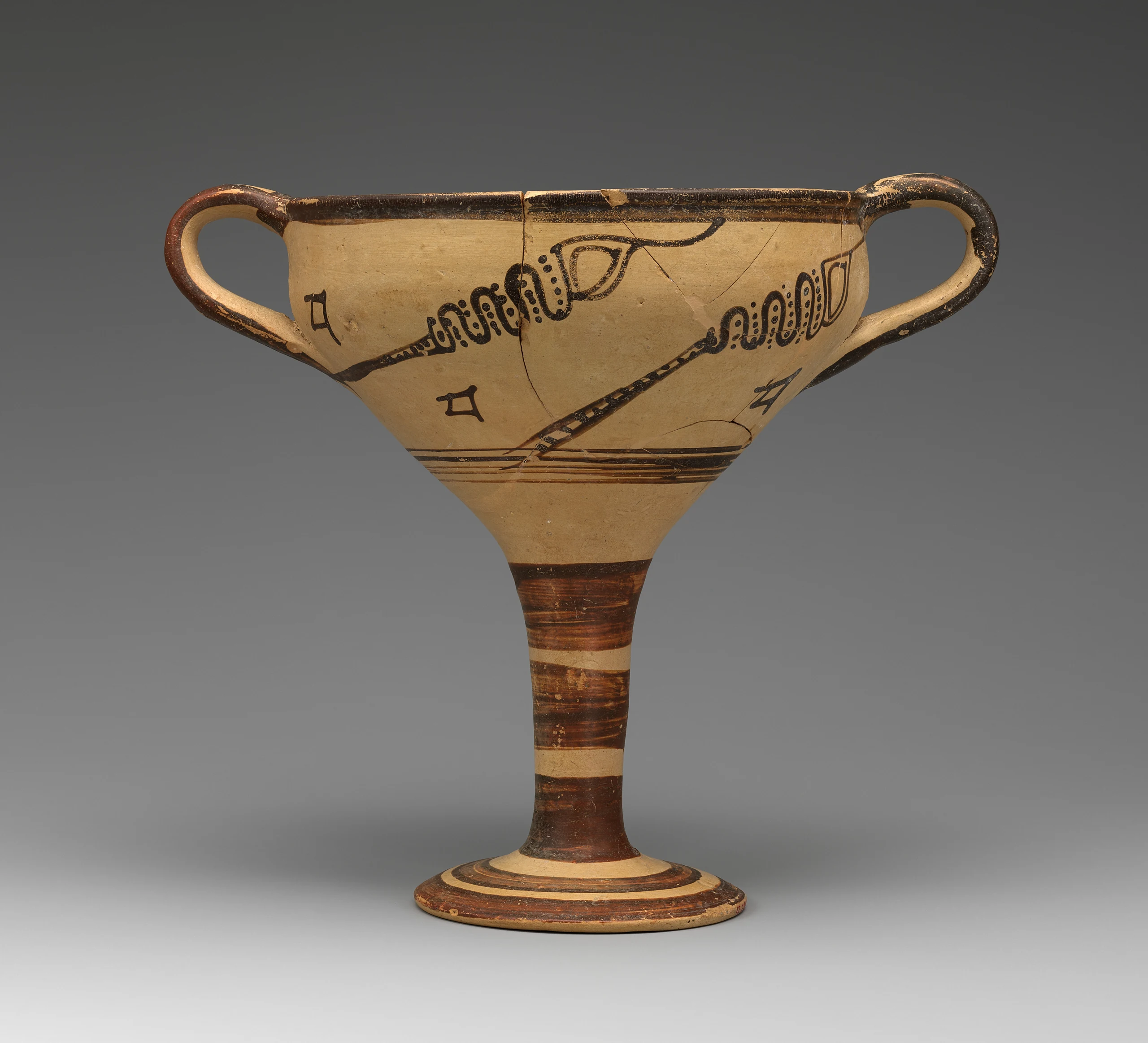 Terracotta stemmed cup with murex decoration