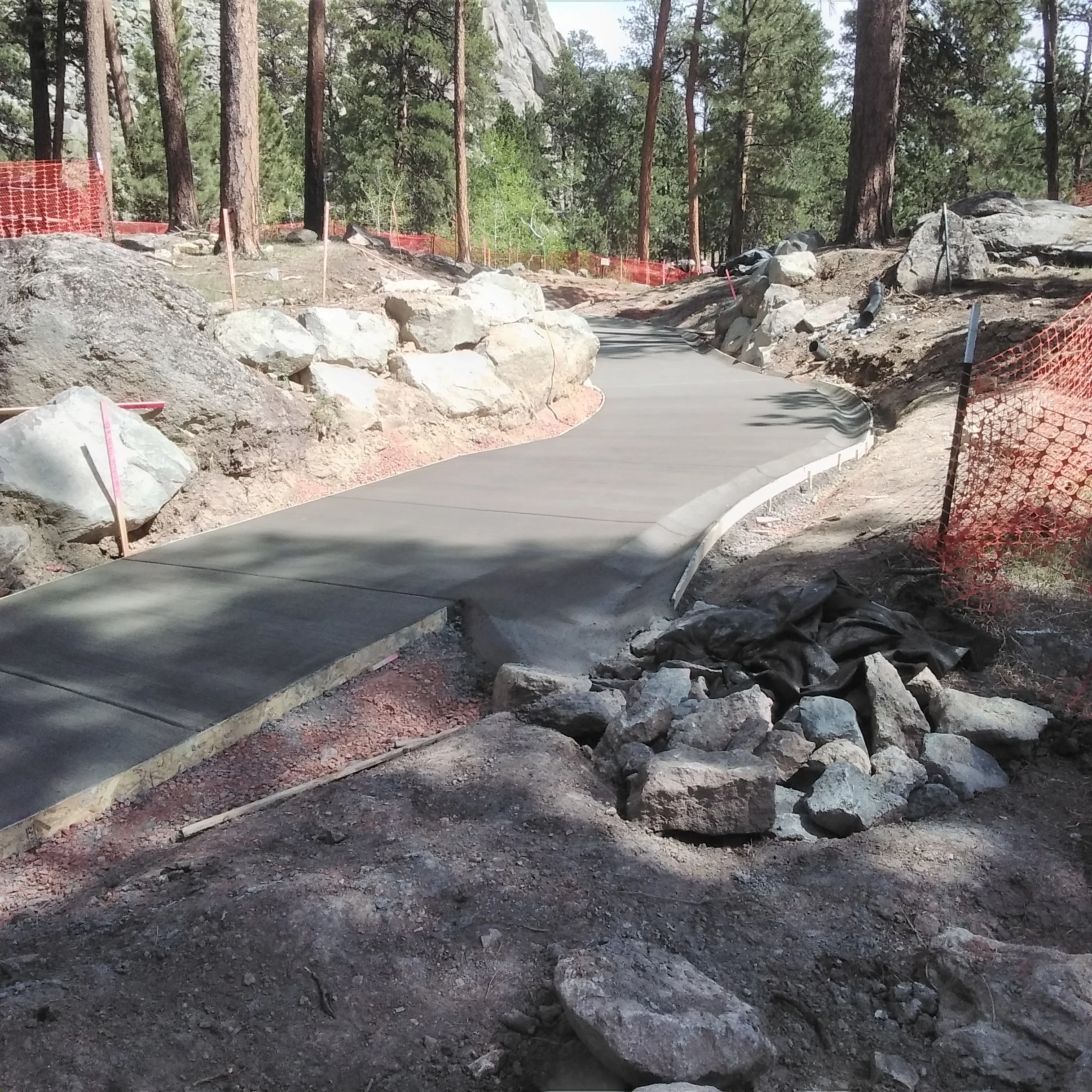 Construction work on an accessible concrete path at Devils Tower National Monument. (c7d1f30a-a8a6-42e1-8c40-13fdaecf2c2