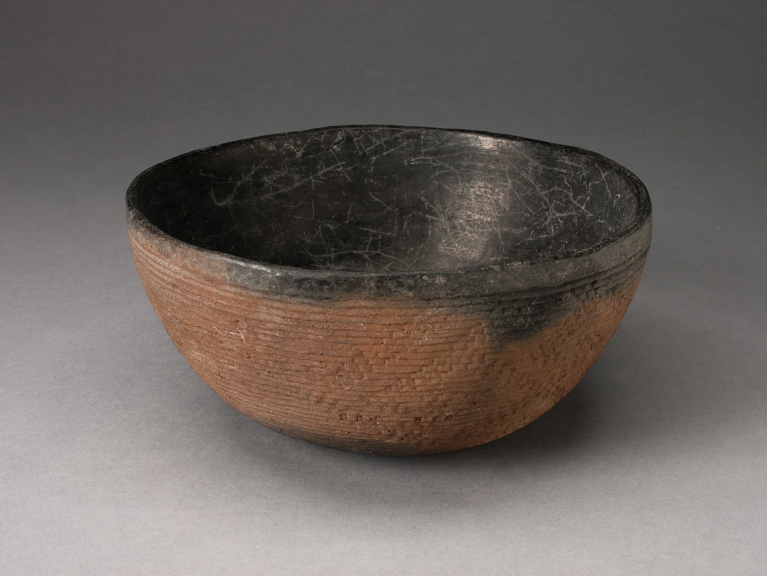 Bowl with Textured Surface Decoration in Basketry-Like Pattern