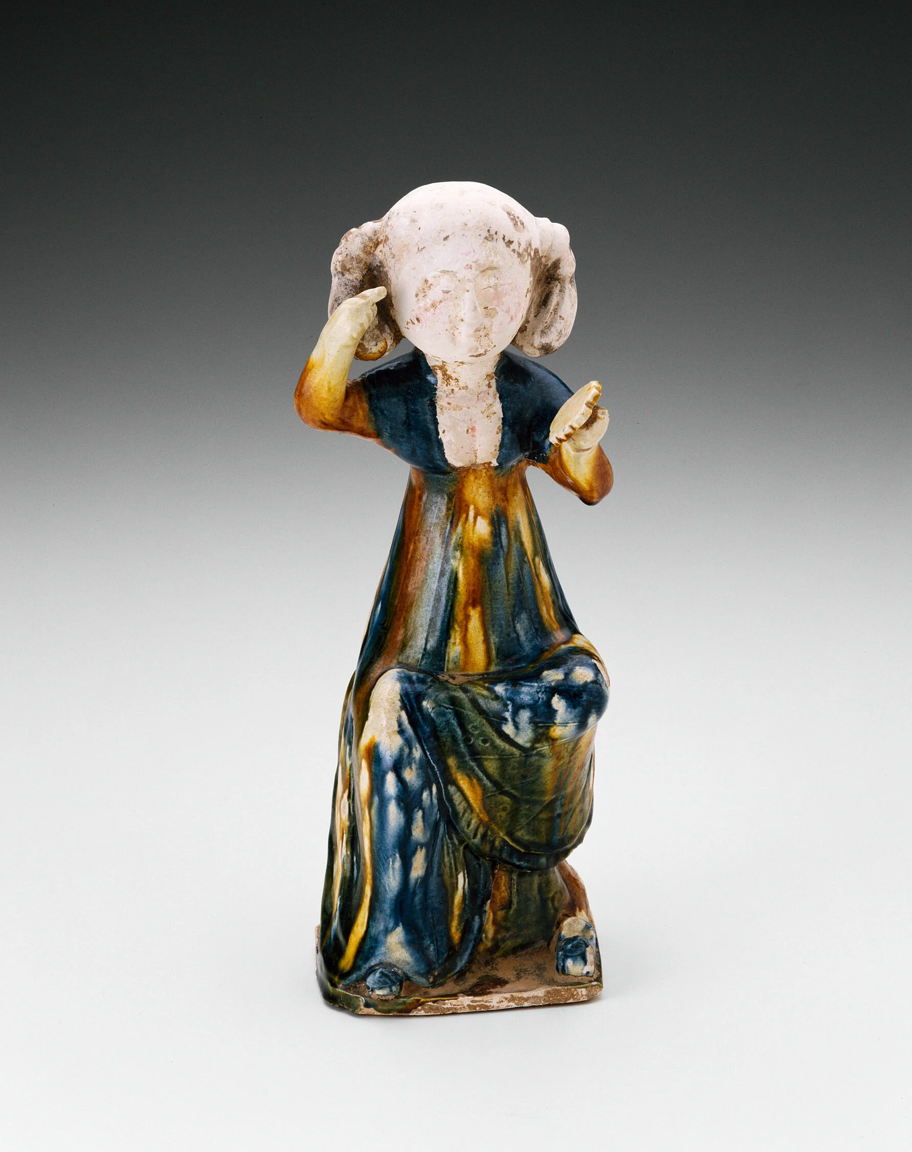 Seated Girl Holding Mirror
