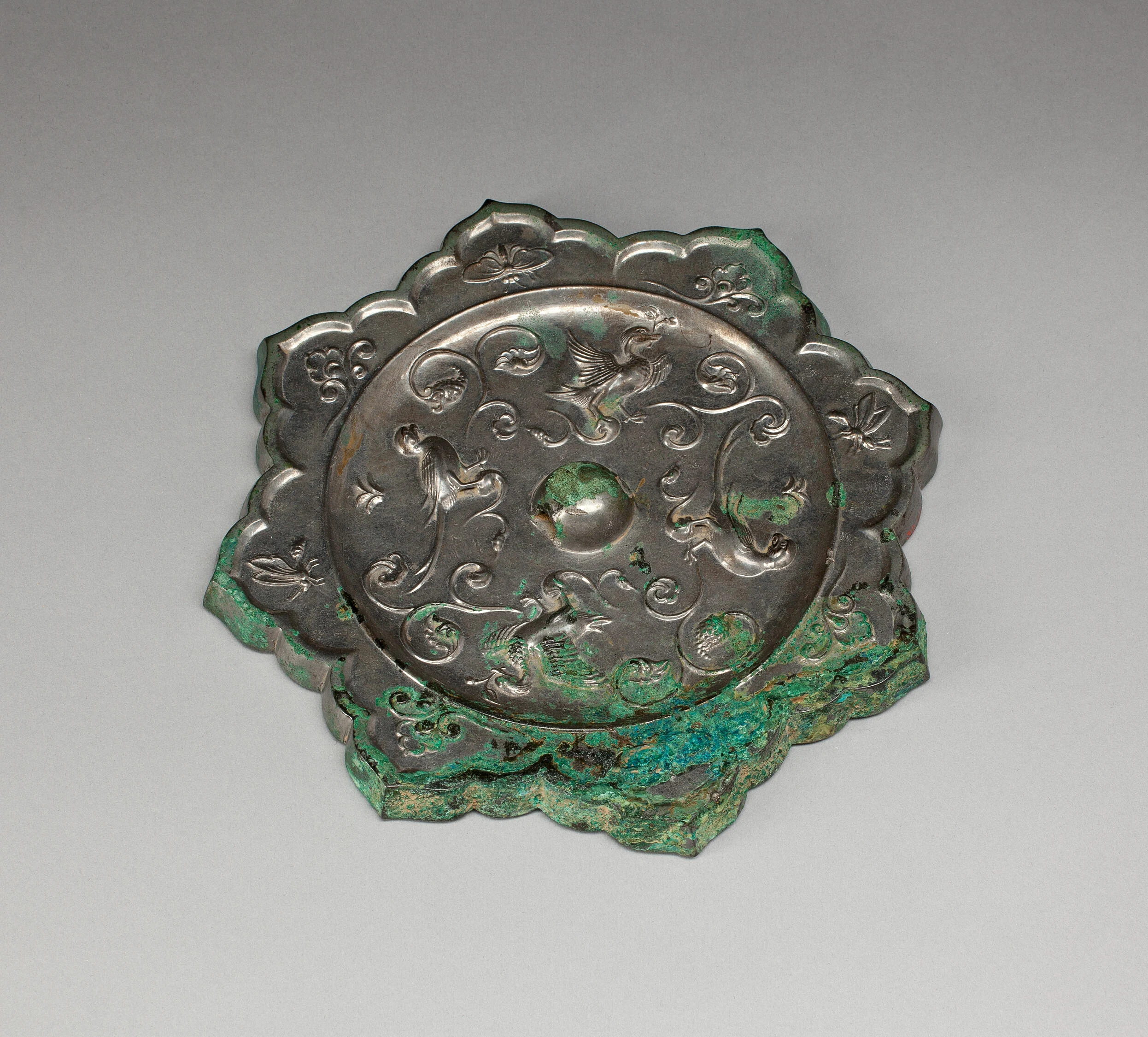 Lobed Mirror with Birds, Insects, and Floral Sprays
