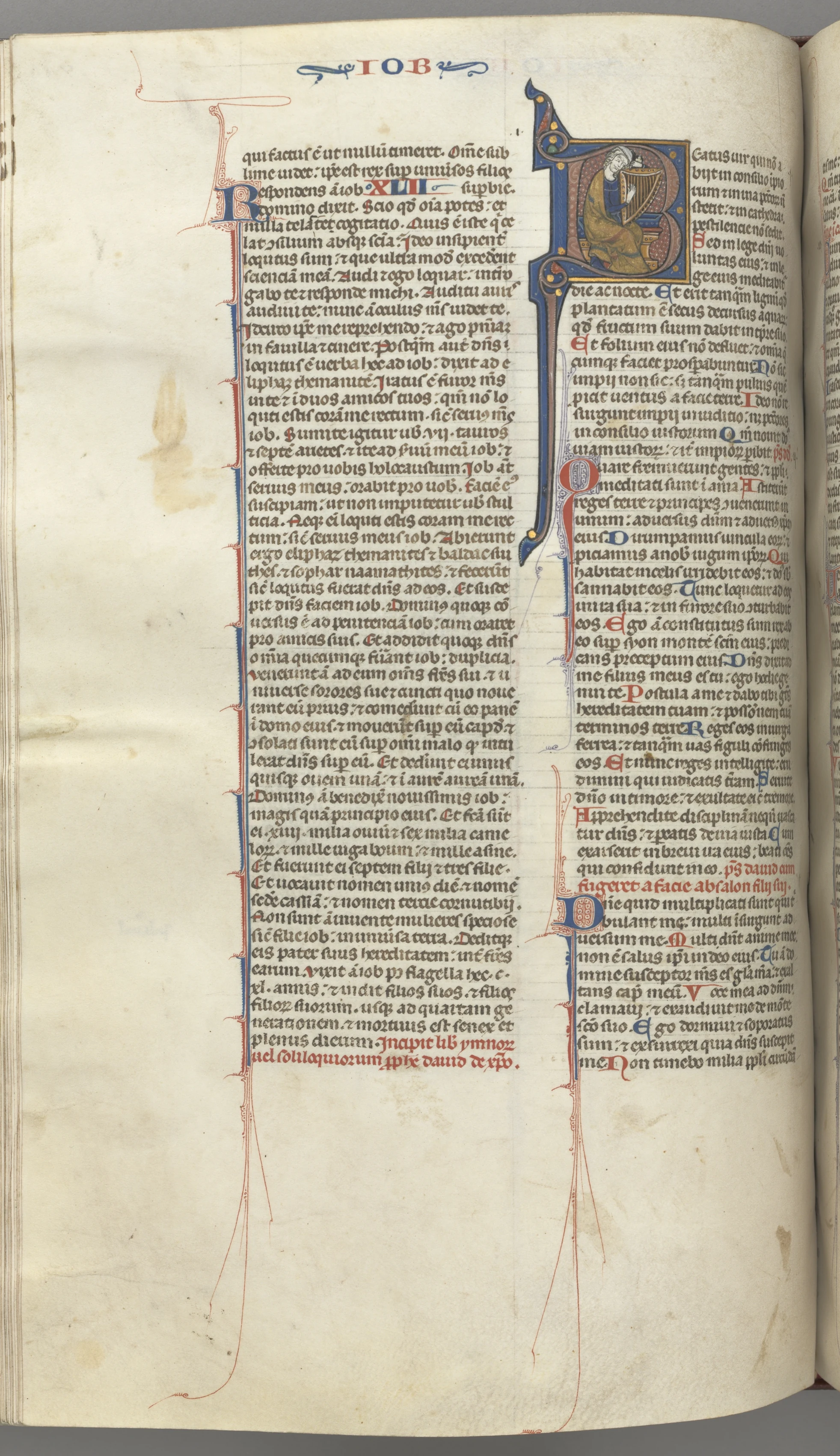 Fol. 214v, Psalm 1, historiated initial 8, David harping