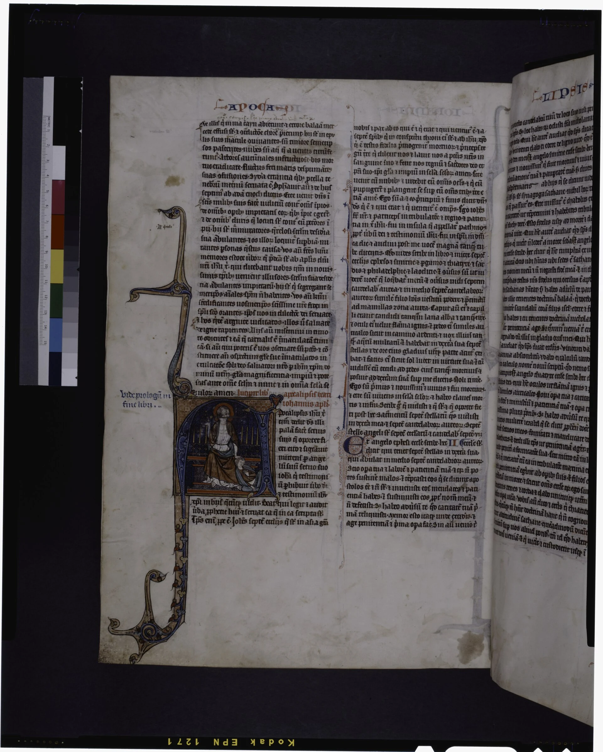 At the opening of Apocalypse, historiated initial by Hand I of John, as if asleep in his vision of Christ with the two-e