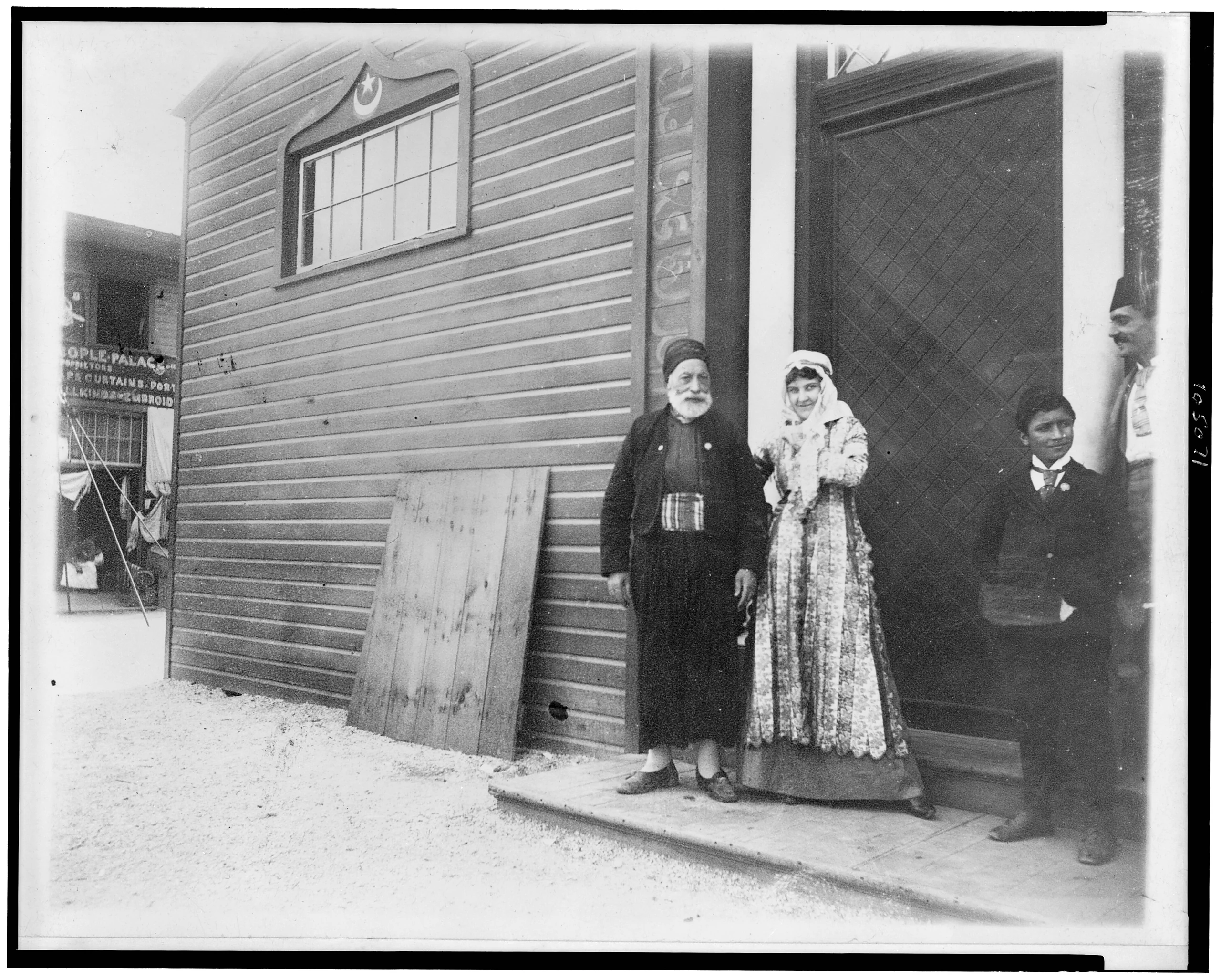 Far-Away-Moses with woman in Middle Eastern dress at World's Columbian Exposition, Chicago, Illinois