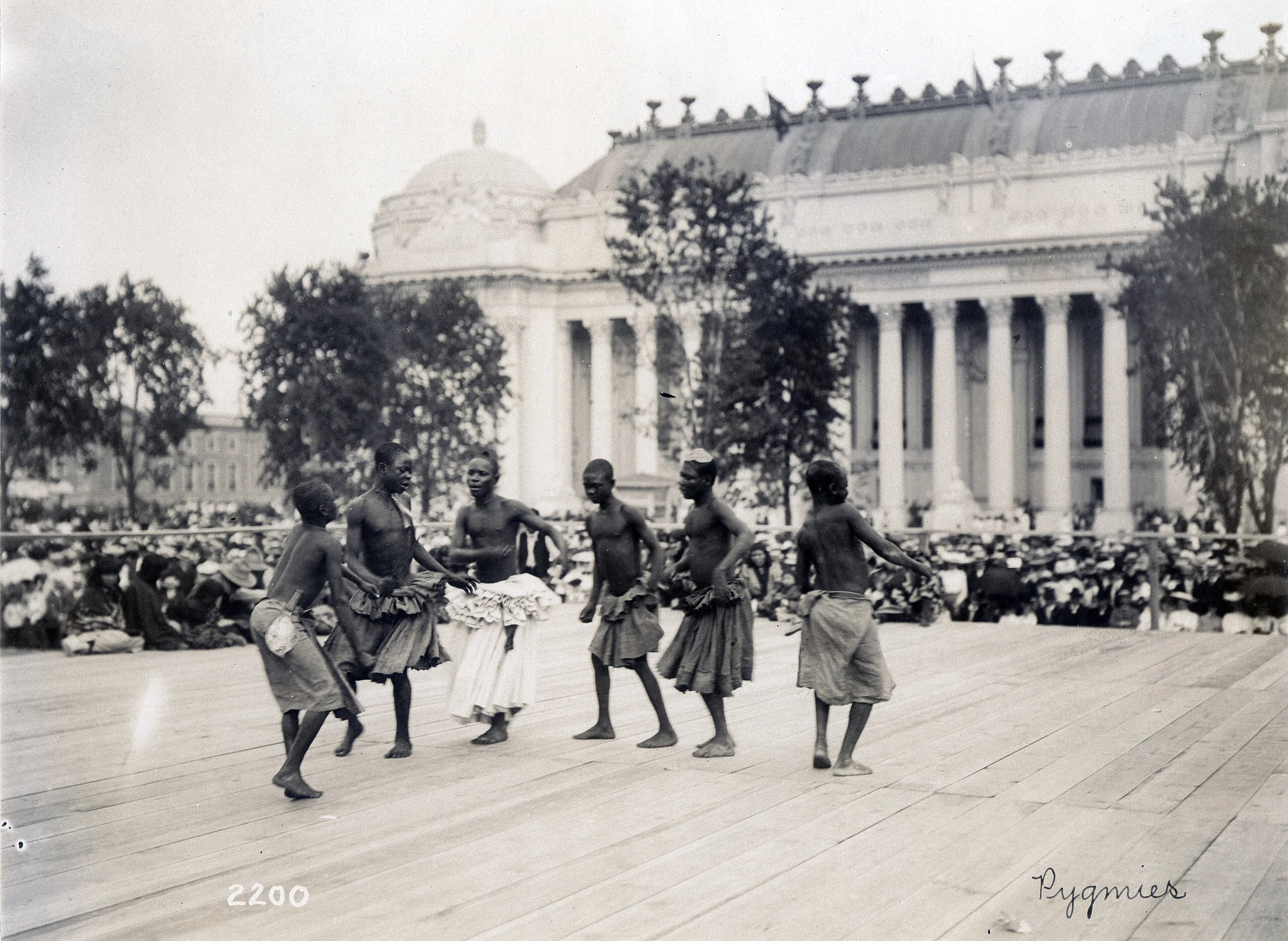 "Pygmies" (Pygmies from Central Africa dancing on platform in front of the Palace of Manufactures at the 1904 World's Fair on 28 July