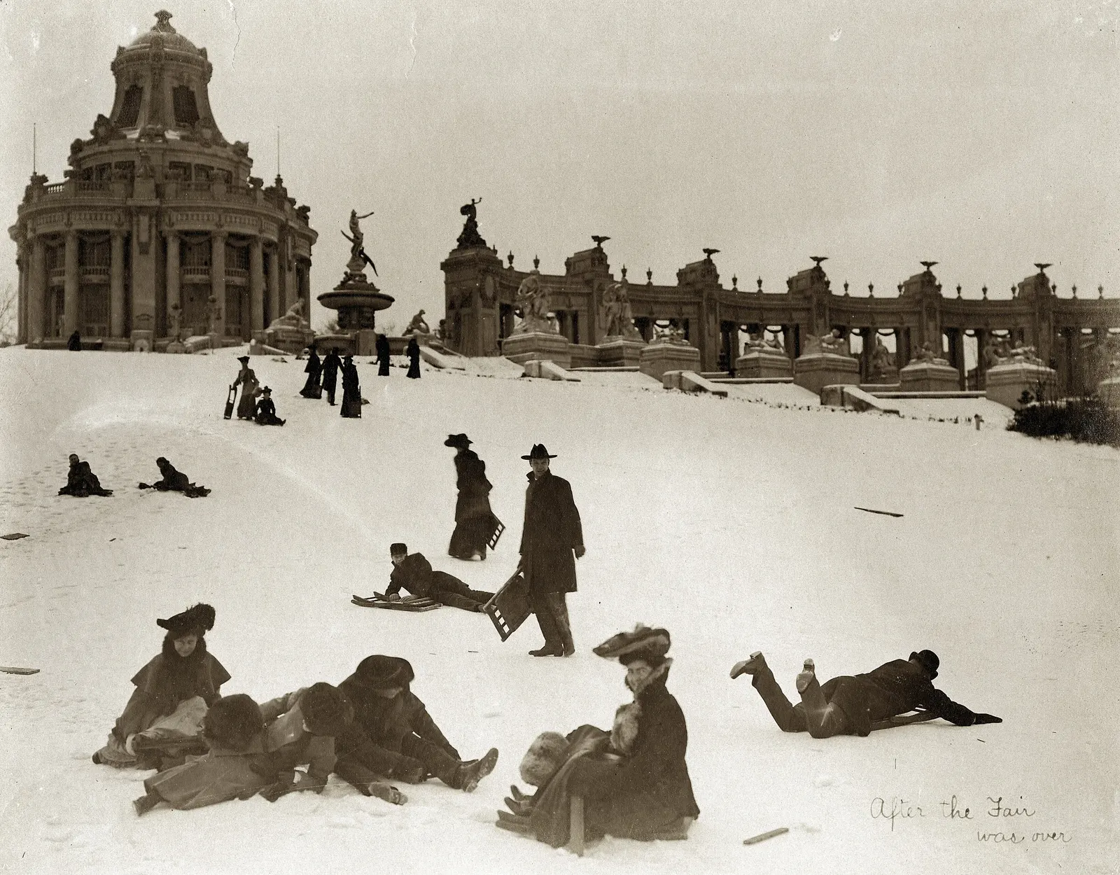 "After the Fair was Over." (People sledding down Art Hill after the closing of the 1904 World's Fair. East Restaurant Pavilion and Co