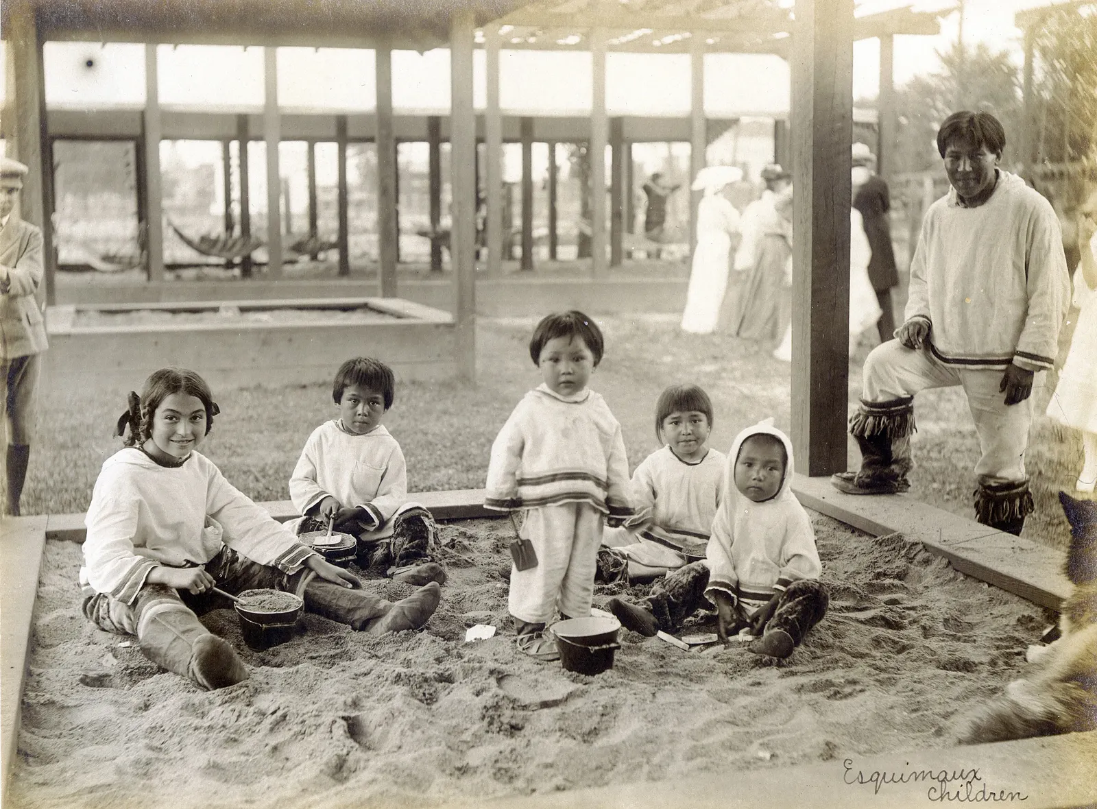 "Esquimaux Children." (children playing in the sandbox at the Model Playground of the 1904 World's Fair).description: Eskimo children