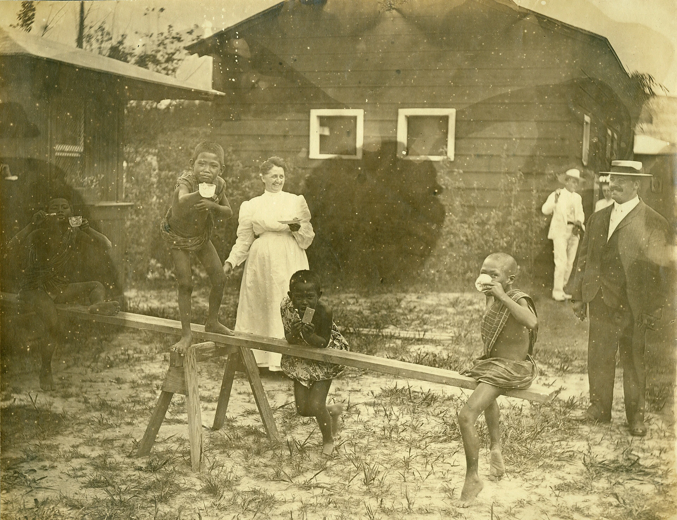 "Model Playgrounds." (Igorrote children on see-saw). Department of Anthropology, 1904 World's Fair.