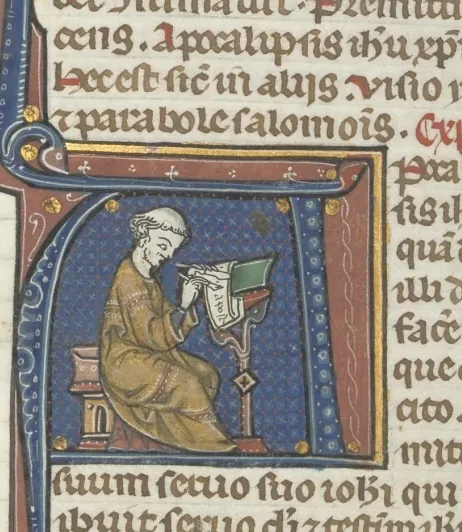 Fol. 482v, Revelations, historiated initial A, John seated at a desk writing to the Seven Churches of Asia