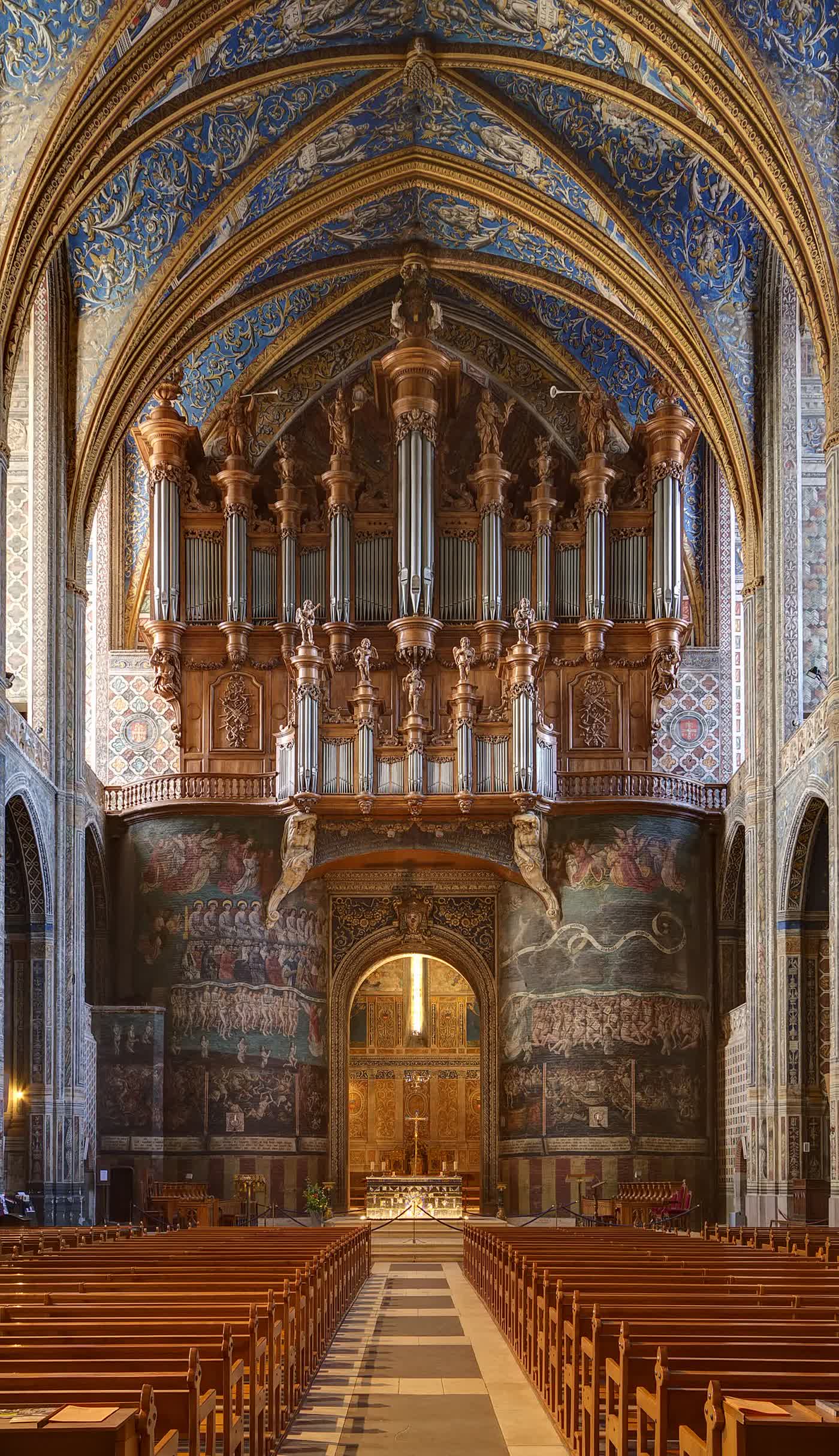 A great pipe organ rising inside a cathedral