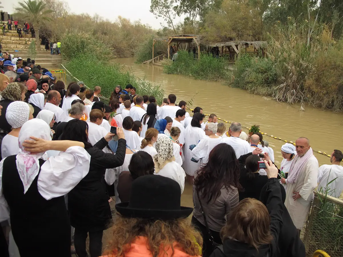 Pilgrims at the Jordan River baptism site of Qasr el-Yahud