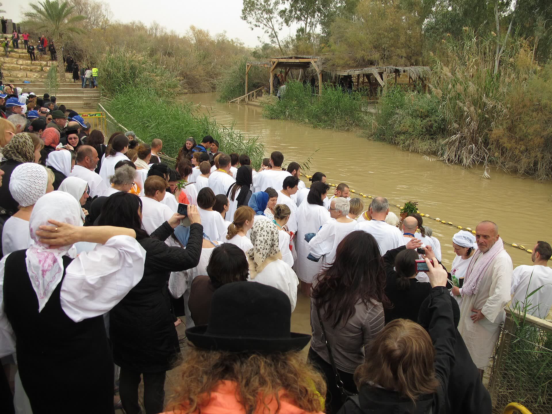 Pilgrims at the Jordan River baptism site of Qasr el-Yahud
