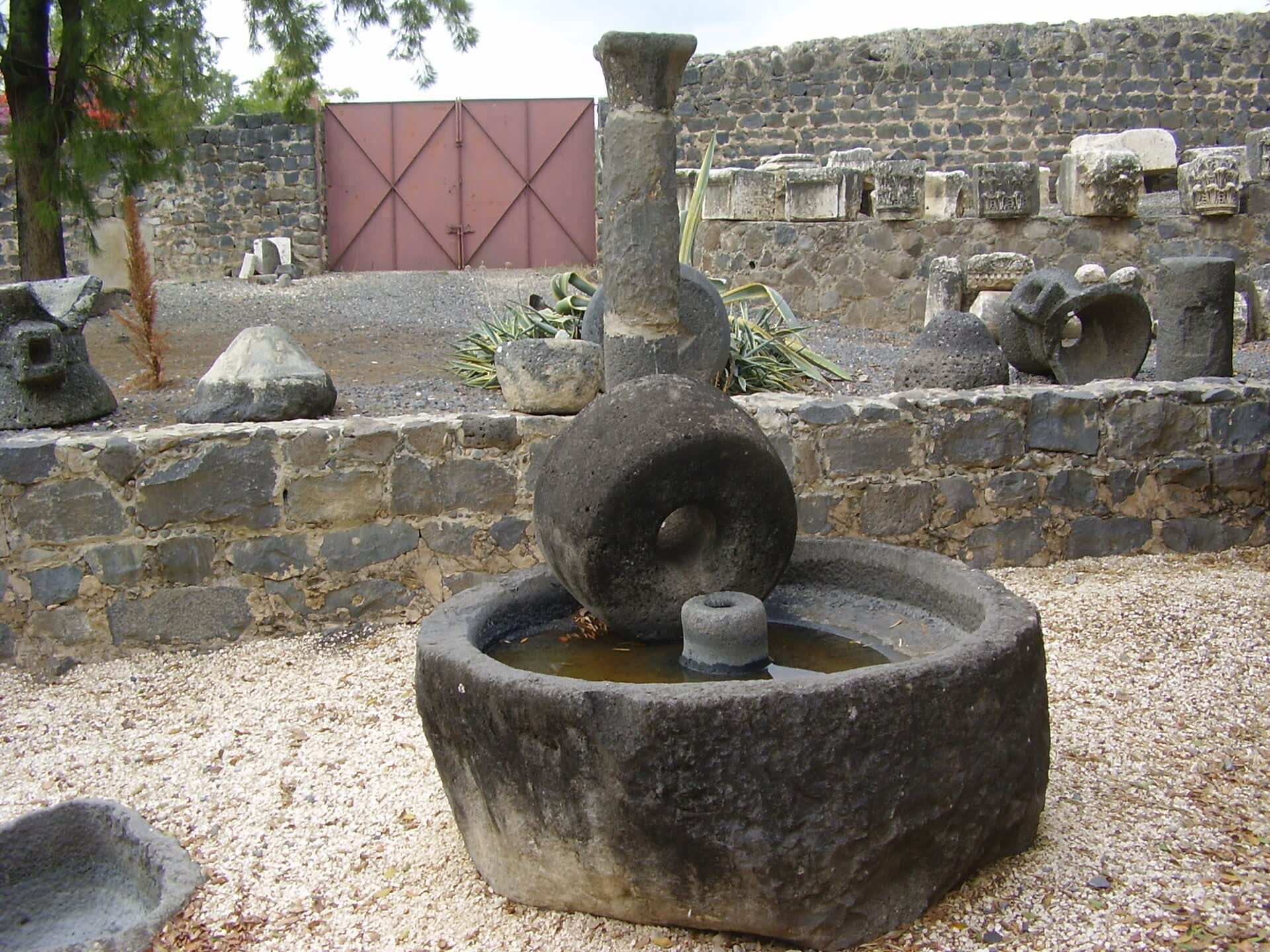 An ancient stone olive press at Capernaum