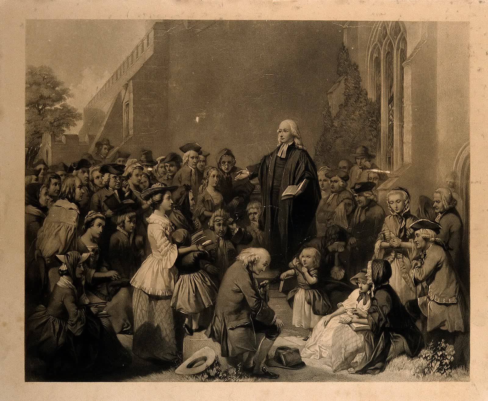 Open-air preaching before a gathered crowd
